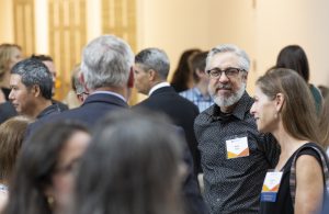 Ceremony attendees gathered in conversation.