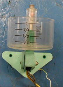 Weight-based rain sensor with large collection cup and numbered measurements