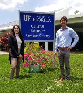 photo of female and male intern in front of UF/IFAS Extension Sarasota County sign