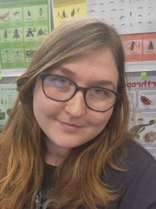 Jackie Lebouitz in front of insect poster