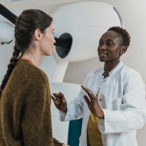 a patient and doctor discuss medical conditions and options. [credit: unsplash.com, accuray]