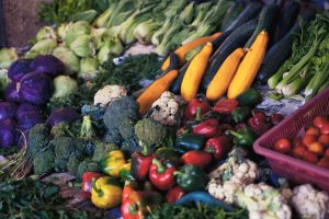 assorted fresh fruits and vegetables for sale in a farmers market display. [credit: unsplash.com, alexandr podvalny]