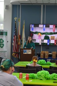 Director Lee Hayes welcomes group and congratulates youth.