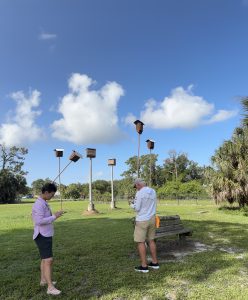Adults test their knowledge as they complete nature-based challenges on the Agents of Discovery app at Venice Area Audubon Rookery. [credit: sarasota county government]