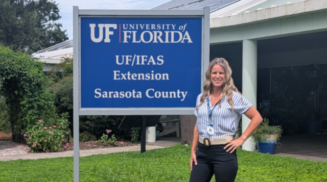 amber daniels, family and consumer sciences agent, stands beside an office sign in front of the uf/ifas extension sarasota county building. [credit: uf/ifas extension sarasota county]