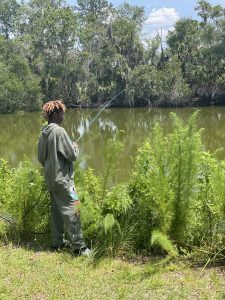 An image of a young boy fishing.