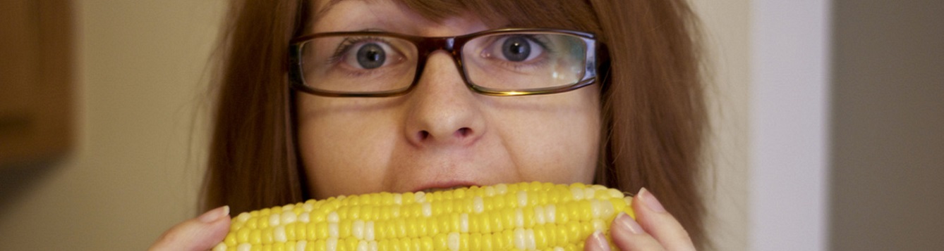 woman eats corn on the cob