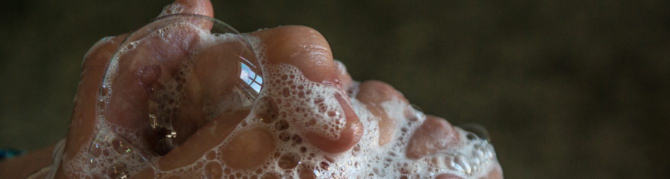 suds on hands clenched while washing. [credit: pxhere.com]