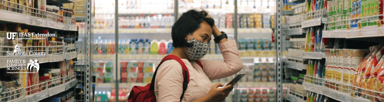 A shopper grapples with products and technology in a grocery store [CREDIT: pxhere.com, Viki Mohamad]