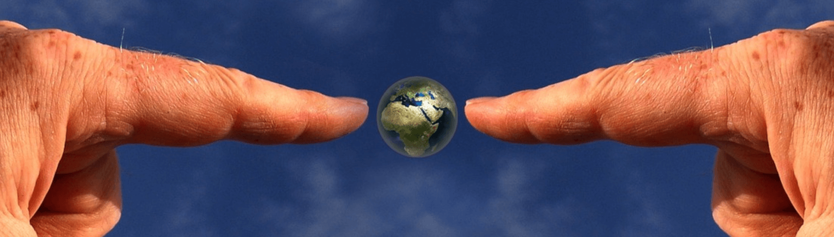 photo-illustration showing two fingers on opposite sides of a small globe of earth, set against a blue background. [credit: pixabay.com, gerd altmann]