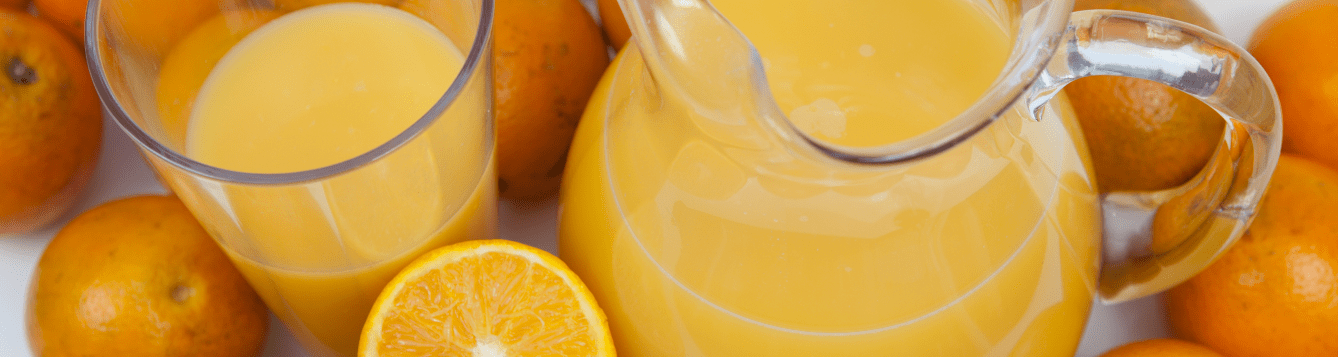 an array of oranges, sliced oranges, orange juice in a glass, and orange juice in a pitcher. [credit: uf/ifas, tyler jones]