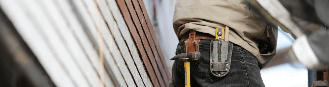 a construction worker outside a home project. [credit: pixabay.com, leeroy agency]