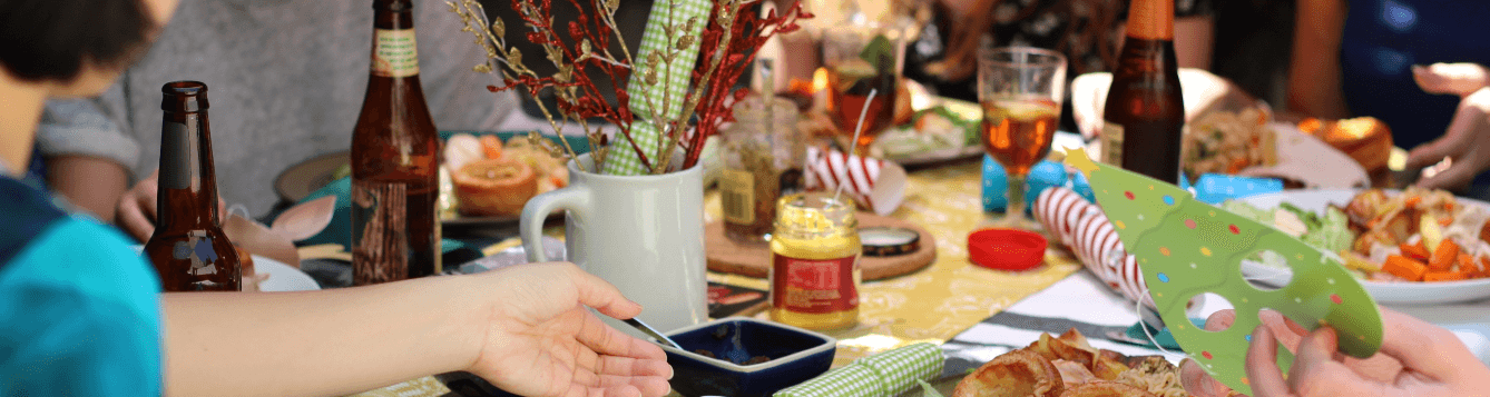 friends gather around a table full of food and beverages for a celebration. [credit: pixabay.com, vivienviv0]