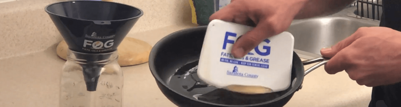 screen shot of video showing sarasota county extension agent scraping grease from a frying pan into a glass jar. [credit: uf/ifas extension sarasota county]