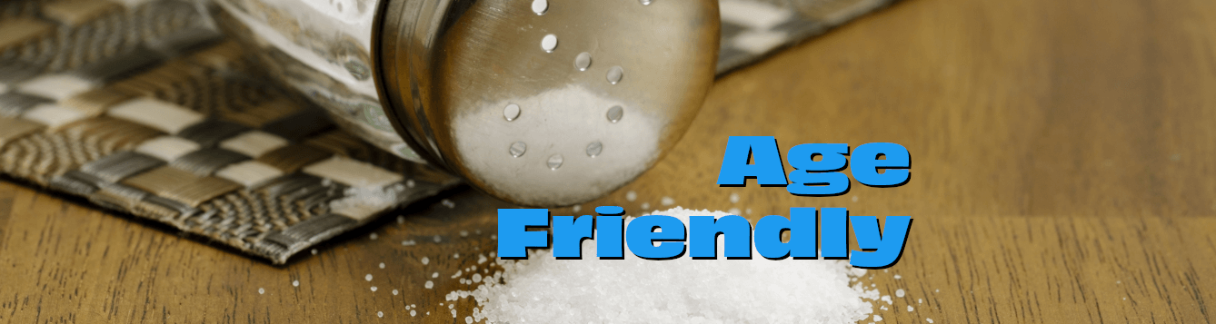 a clear, glass salt shaker lies toppled over on a wooden surface, with a small pile of salt nearby. [credit: pixabay.com, bruno germany]