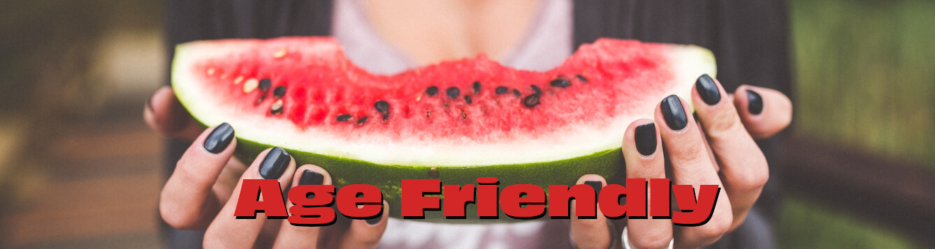 a person uses two hands (with black-painted fingernails) to hold up a watermelon wedge with several bites taken from it. [credit: pixabay.com, foundry co]