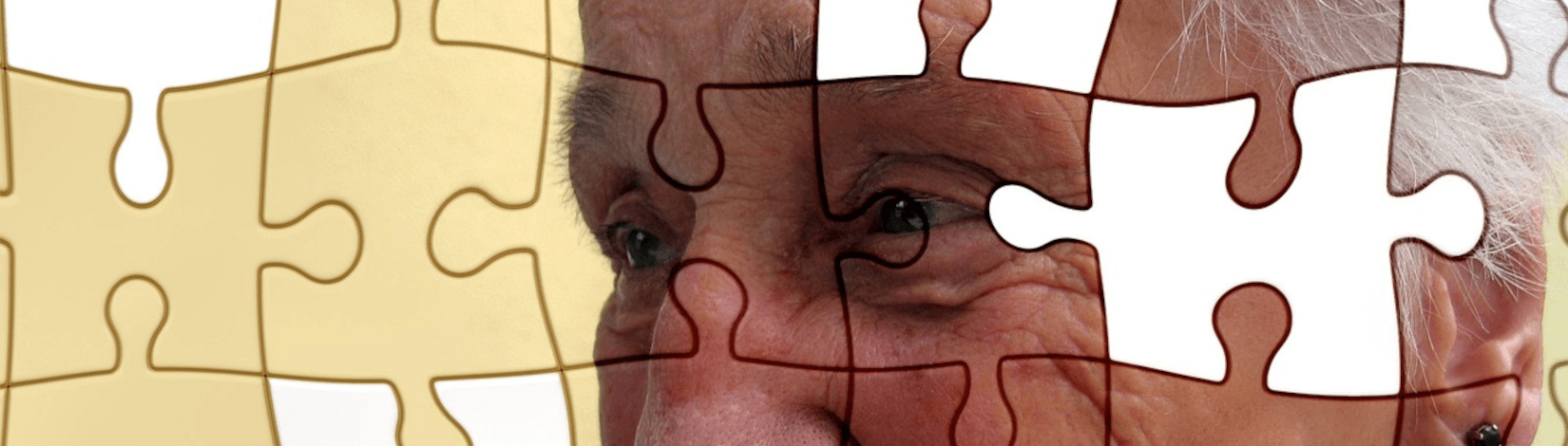 closeup of an older woman's eyes, with a puzzle overlay and missing puzzle pieces. [credit: pixabay.com, gerd altmann]