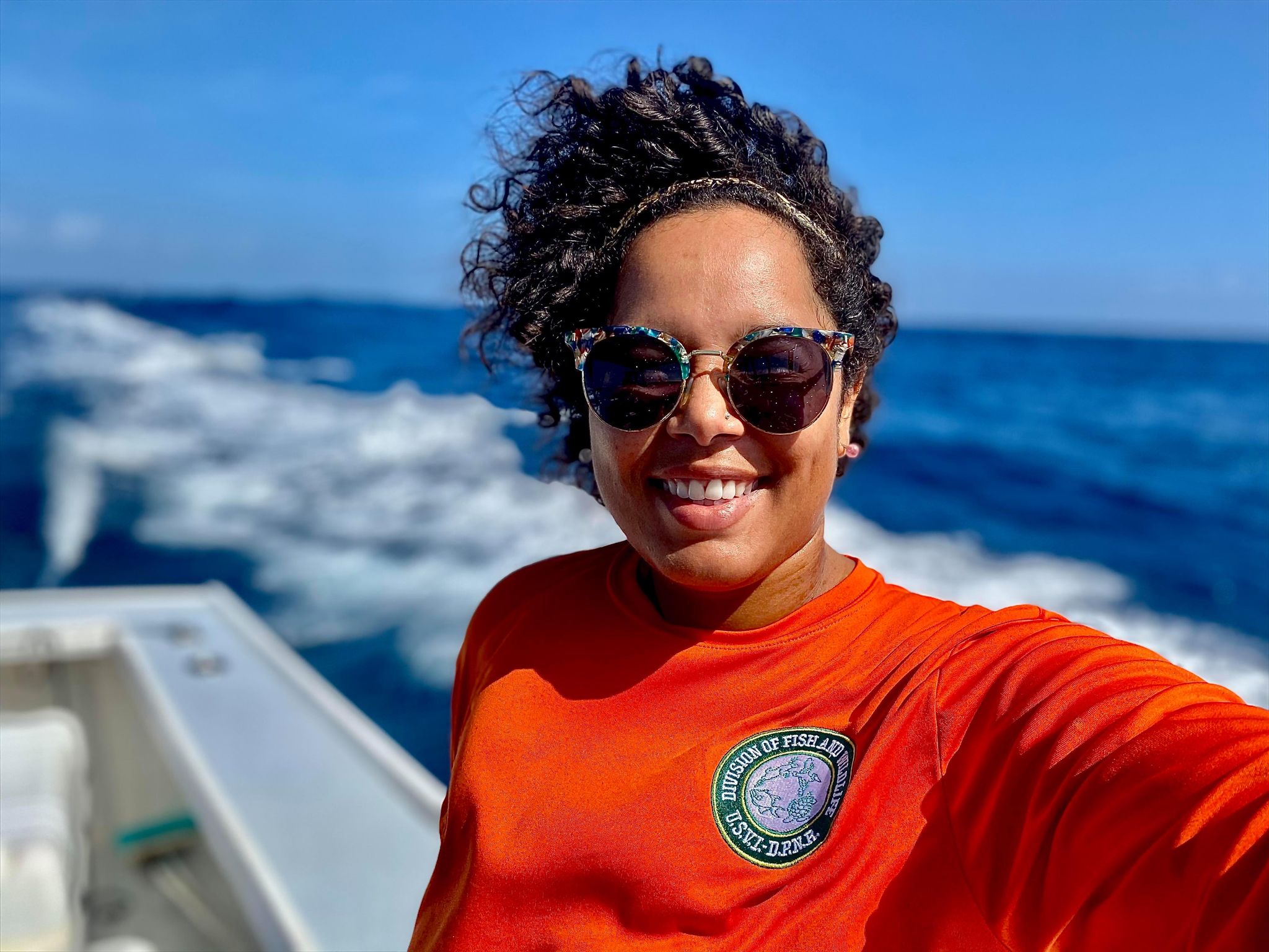 Carter smiling on a boat
