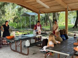 Native Americans showing 4h students how to make fry bread