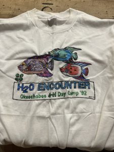 White tshirt with glitter art and lettering for h2o camp