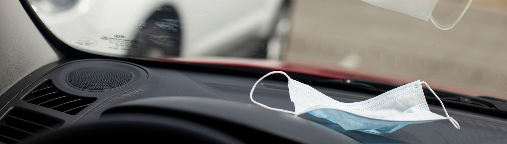 Surgical facemask in a car.