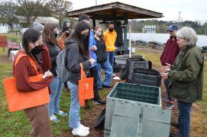 a professor discusses composting with students