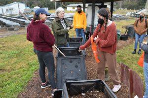 a professor discusses composting with students