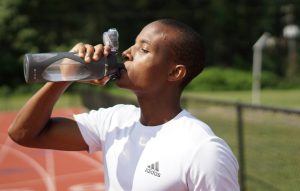 Man drinking water from water bottle