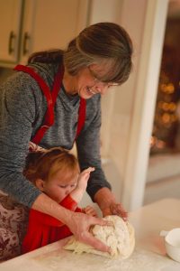 Grandmother and child baking