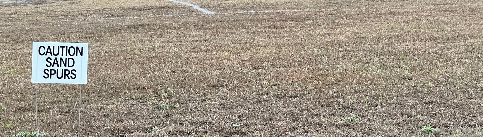 Caution sign in field