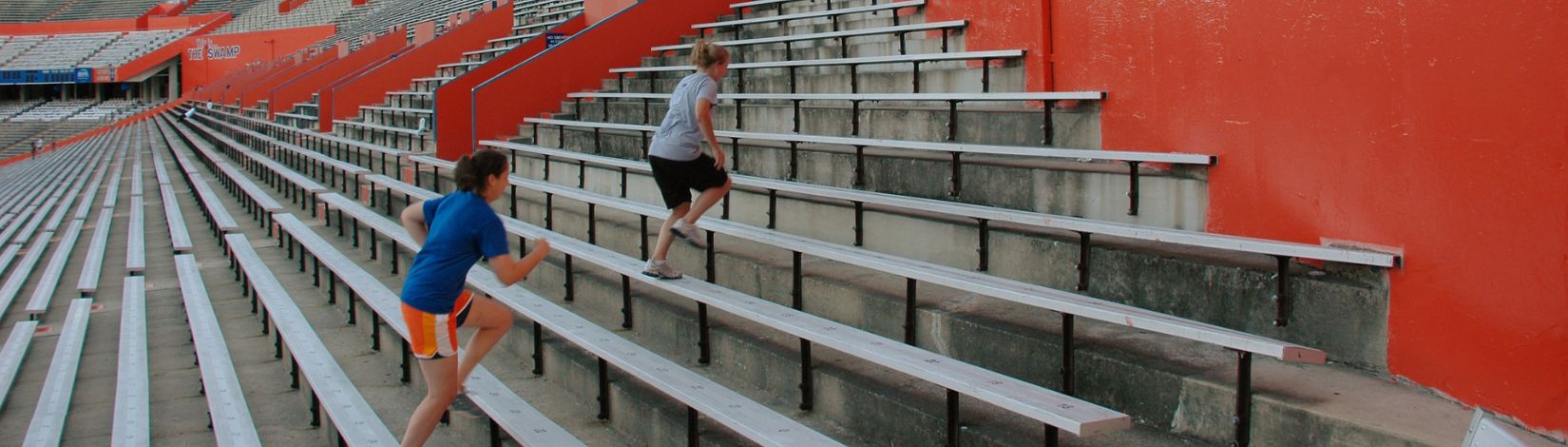 Students running in the Ben Hill Griffin Stadium at the University of Florida, exercise, bleachers, fitness. UF/IFAS Photo: Sally Lanigan.