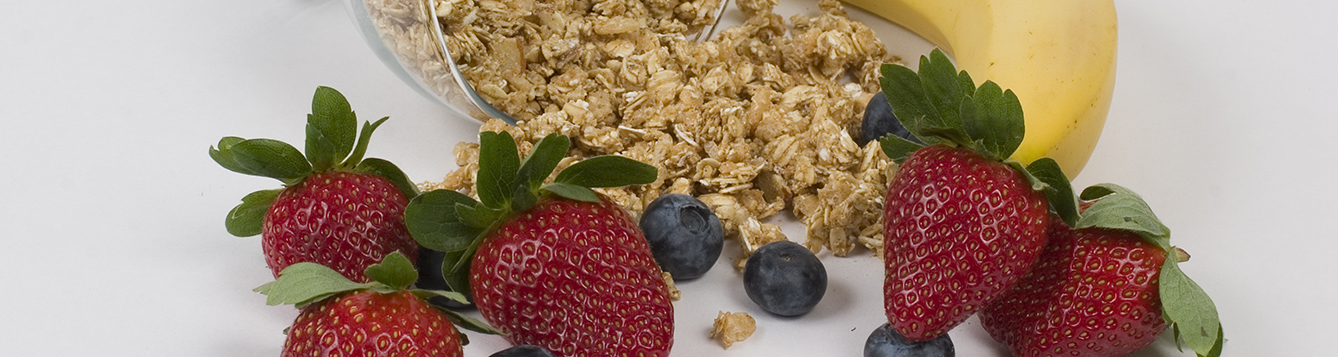 Strawberries, blueberries, cereal grains, and a banana.
