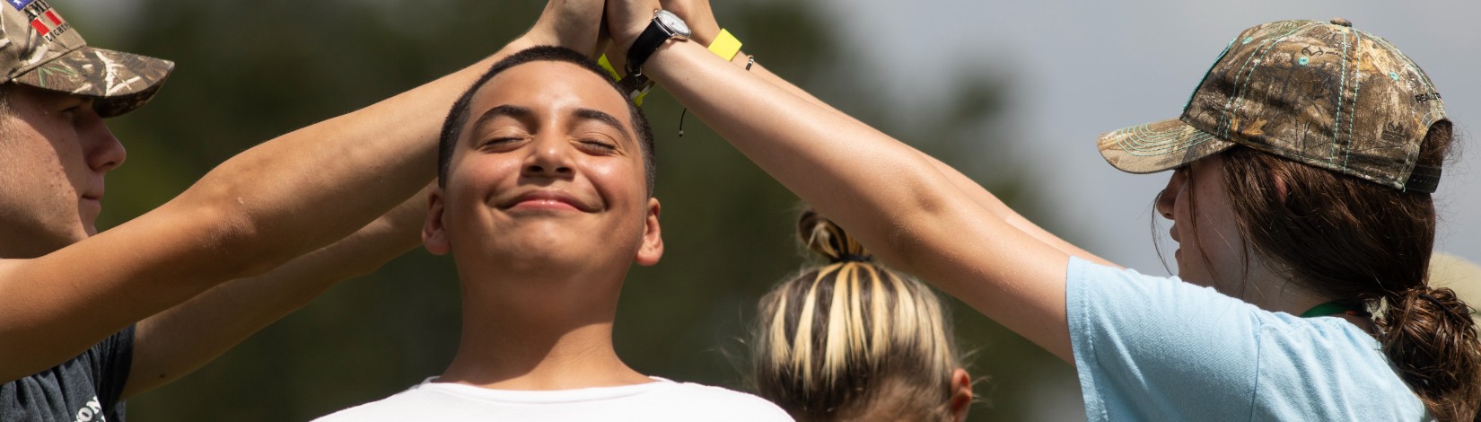 4H youth playing a game at Camp Cloverleaf.