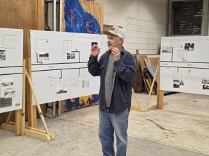 Man speaking in front of history timeline about Wakulla.