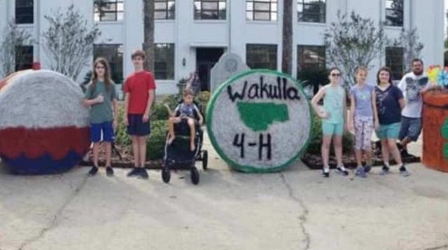 Haybales in front of building.