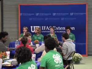 Youth speak at a lunch gathering.