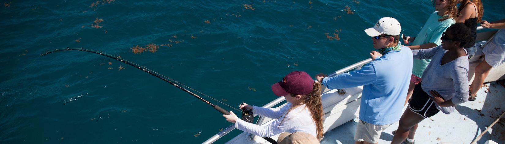 Students fish off the shore of the Florida Keys.